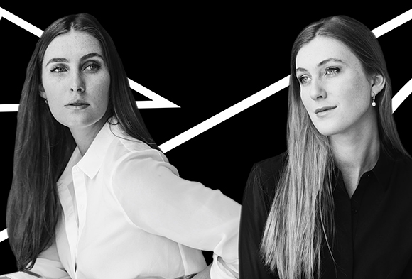 Black and white portrait of two women with long hair against a black background with white lines.