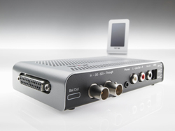 Silver electronic device with multiple input and output ports on a reflective white surface.