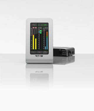 A silver RTW Loudness meter with a digital display and colorful level indicators next to a black electronic device.
