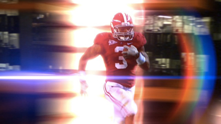 A football player in a red jersey and helmet running forward amidst bright light flares and motion blur.