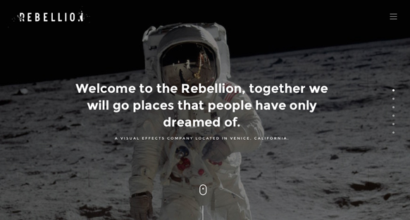 An astronaut in a white spacesuit stands on a lunar landscape under a dark sky.
