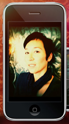 A smartphone screen showing a portrait of a woman with short dark hair and a dark scarf.