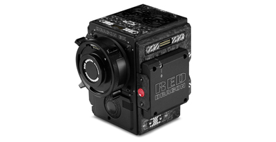 A black RED Dragon digital cinema camera with a large lens mounted on the front.