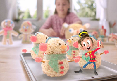 An animated boy in a red uniform takes a selfie with rice cereal snowman treats on a baking sheet.