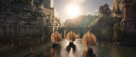 Sailing ships navigate a river flowing through a massive, tiered ancient stone city under a bright sun.