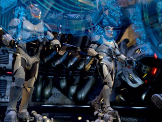 Two white armored robotic figures standing beneath glowing blue holographic interfaces.