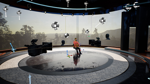 A virtual 3D studio with a character on a circular platform surrounded by floating lights and cameras.