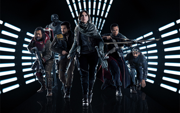 Five characters in sci-fi combat gear walking toward the camera against a dark background with white light bars.
