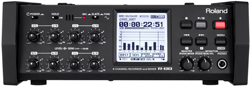 Front view of a black Roland R-08 digital recorder with various knobs, buttons, and a digital display screen.