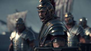 A group of soldiers in metallic armor and helmets standing in formation.