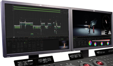 Two computer monitors side-by-side showing complex video editing interfaces and timelines.