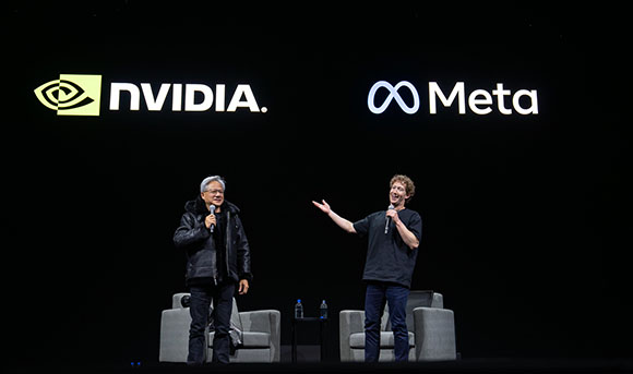 Two men standing on a dark stage in front of large NVIDIA and Meta logos.