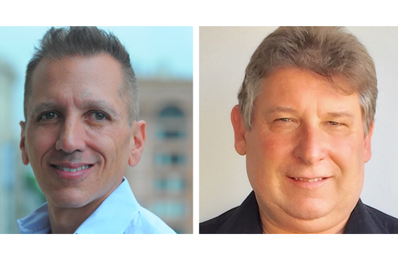 Two headshots of men, one with short dark hair in a light blue shirt, the other with wavy brown hair in a black shirt.