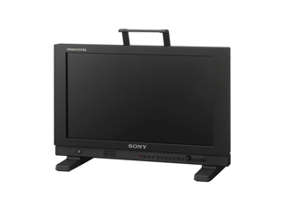 A black Sony Trinitron professional monitor with a carrying handle on top, set against a white background.