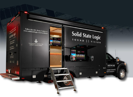 Black Solid State Logic demo truck with an open side door revealing an interior and external display screens.