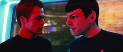 Two men in profile facing each other under intense red lighting.