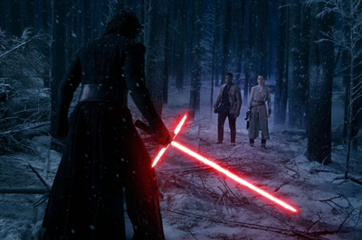 A person in black holds a red crossguard lightsaber facing two people in a snowy forest.