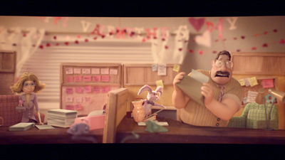 An animated man reads a letter at a desk while a woman sits in the background of a decorated office.