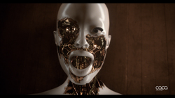 A white mannequin head with gold mechanical components visible through cracks in the face.