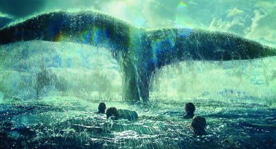 A giant whale tail breaches the surface of a turbulent, turquoise ocean near several people swimming.