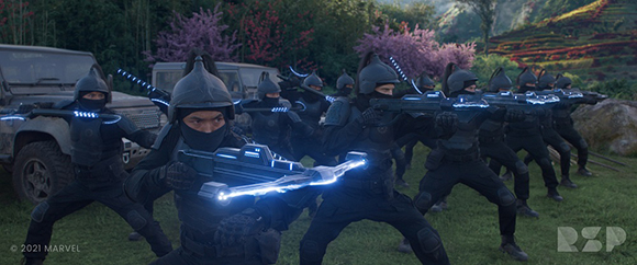 Several figures in dark armor aim futuristic weapons with glowing blue lights in a forest setting.