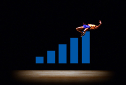 A person in blue and yellow clothing falling backward from the highest bar of a rising blue bar graph.