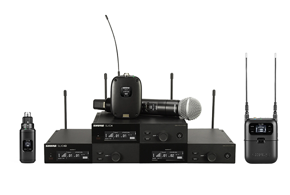 Various black Shure wireless microphone receivers, transmitters, and handheld microphones on a white background.