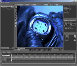 A software interface showing a blue-tinted close-up of a circular metallic device held by gloved hands.