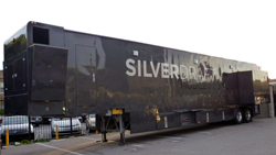 A long, black Silverdraft Mobile trailer parked in a paved lot during the day.