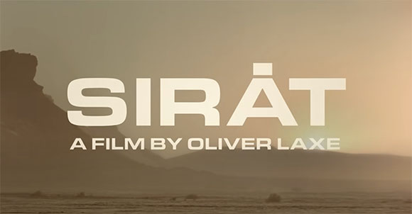 Title card for the film Sirát by Oliver Laxe against a hazy landscape.