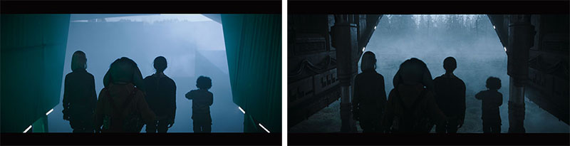 Silhouettes of five people standing in a dark, foggy landscape viewed through a doorway.