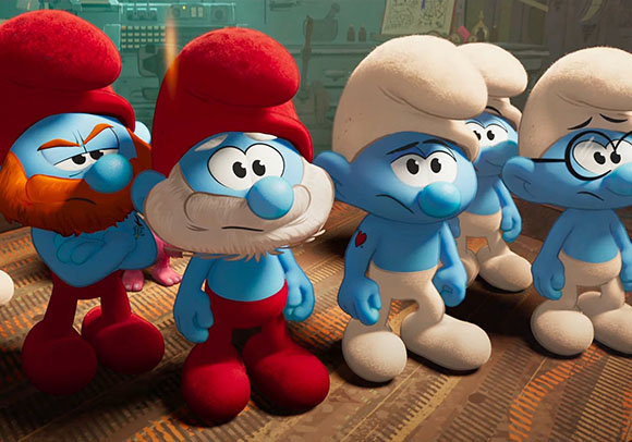 Five blue Smurfs with various hats and facial hair stand in a line with somber expressions.