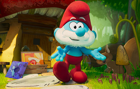 A blue Smurf with a red hat and pants stands with arms outstretched in a forest.