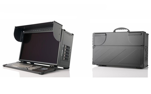 A black portable computer terminal with a screen and keyboard next to its closed carrying case.