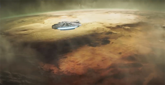 A saucer-shaped spacecraft flies above a vast, orange-hued desert planet under a hazy sky.