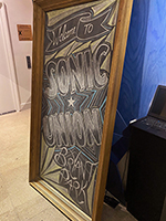 Chalkboard sign with "Welcome to Sonic Union" and decorative elements in chalk.