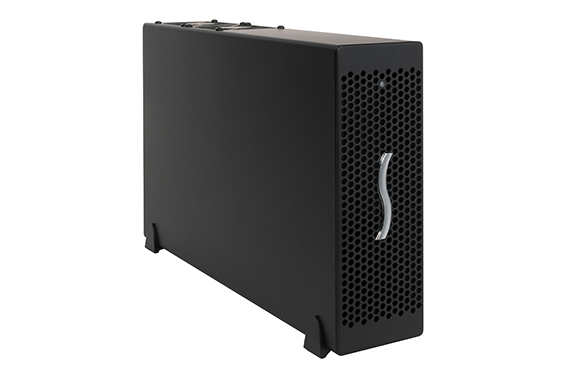 A black rectangular electronic device with a honeycomb mesh front panel and a silver S-shaped accent.