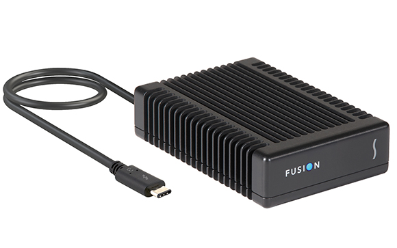 A black rectangular electronic device with cooling fins and an attached USB-C cable.