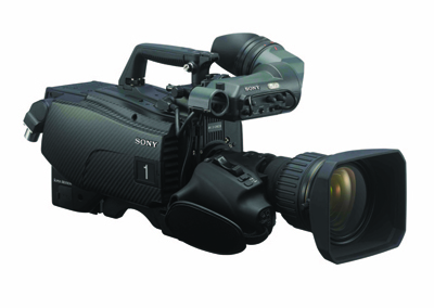A black professional Sony video camera with a large lens and top handle against a white background.