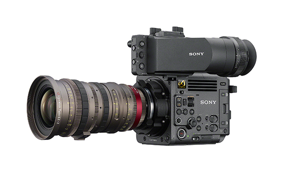 A black Sony professional cinema camera equipped with a large, long cinema lens.
