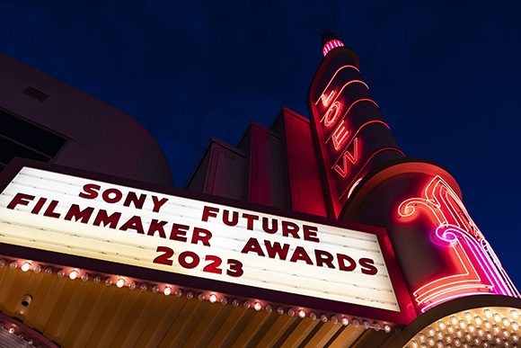 A lit theater marquee at night reads 'SONY FUTURE FILMMAKER AWARDS 2023' in red letters.