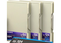 Three Sony video cassettes with blue and purple labels standing in a row.