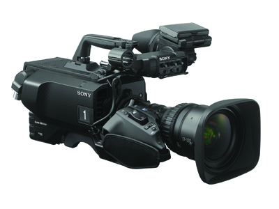 A black Sony professional video camera with a large lens and top handle against a white background.