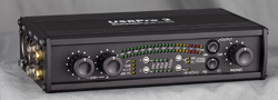 A black UsPro audio interface with various knobs, buttons, and LED indicator lights on the front panel.