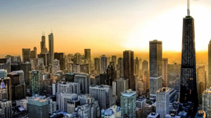 Aerial view of the Chicago skyline during sunset with the John Hancock Center prominent on the right.