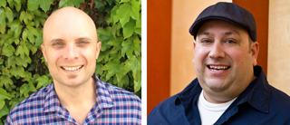 Two smiling men, one bald in a plaid shirt and one wearing a dark cap and navy shirt.