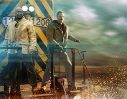Two men in jackets stand on a moving vehicle against a blurred, motion-streaked background with flying sparks.