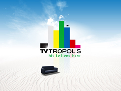 TV TROPOLIS logo with colorful bars above a black sofa on white sand under a blue sky.