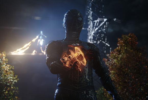 A dark superhero figure holds a glowing, golden hammer-shaped object against their chest at night.