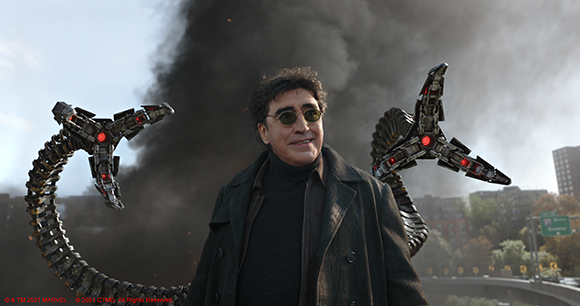 A man in a dark coat and sunglasses with large mechanical tentacles behind him against a smoky sky.